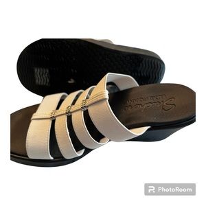 Skechers Luxe foam white shoe slip on mid wedge sandal.